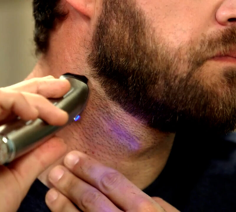 man shaving neckline
