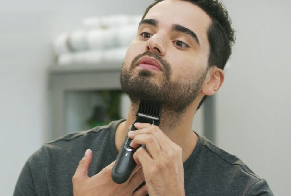 Man trimming beard